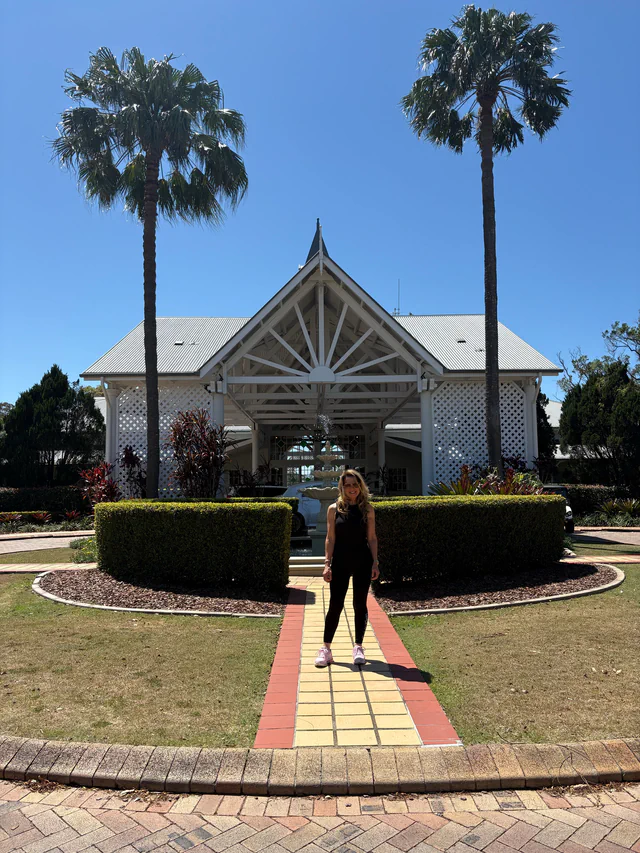 Jasmyn outside the resort entrance at Sanctuary Cove, Queensland